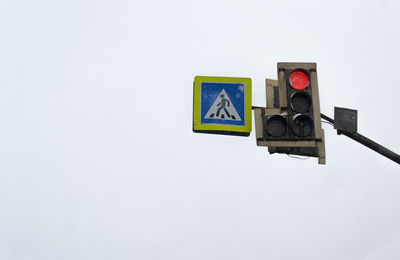 Close-up of information sign against white background