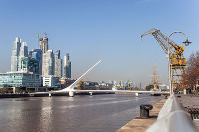 City by river against sky