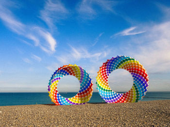 Multi colored circles on beach