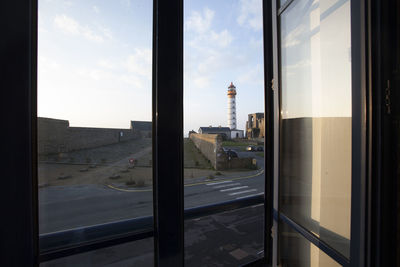 Buildings seen through glass window