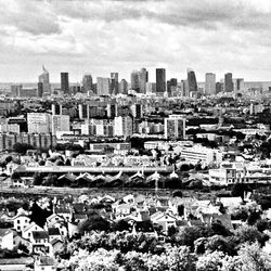 High angle view of city against cloudy sky