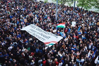 High angle view of crowd with banner during protest rally