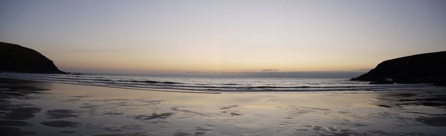 Scenic view of sea at sunset