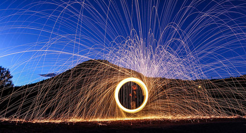 Light painting against mountain at night