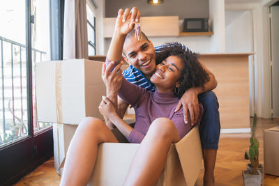 Happy woman sitting at home