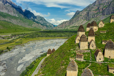 Panoramic view of buildings and mountain against sky