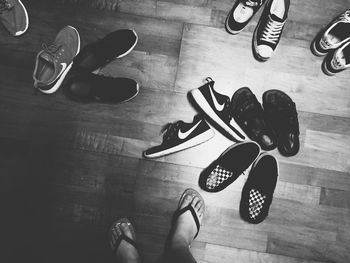 Low section of man wearing shoes on floor