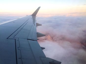 Cropped image of airplane flying in sky