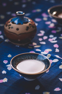 Drink in tenmoku on tablecloth