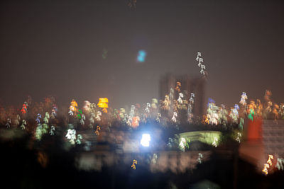 Illuminated buildings in city at night