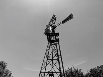 Low angle view of traditional windmill against sky