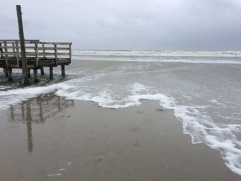 Scenic view of beach against sky