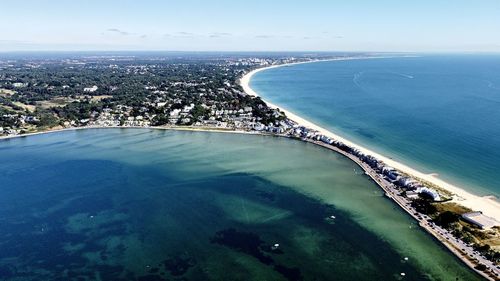 High angle view of bay against clear sky