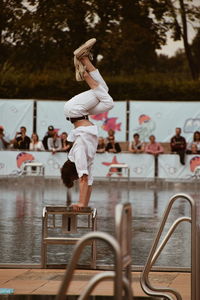 Man jumping in swimming pool