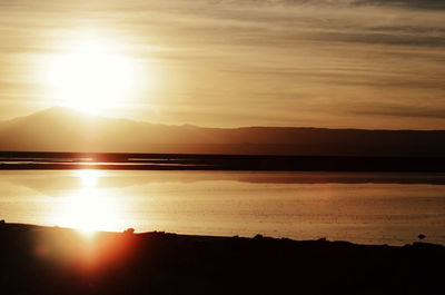 Scenic view of lake against sky during sunset