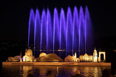 Panoramic view of illuminated building at night