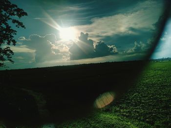 Scenic view of field against sky during sunset