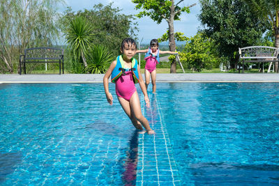 Portrait of woman swimming in pool