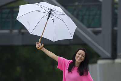 Portrait of woman holding umbrella