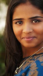 Close-up portrait of a smiling young woman