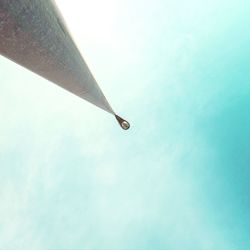 Low angle view of balloons against blue sky