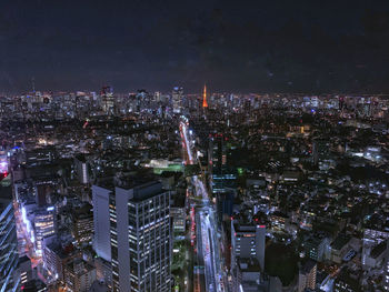 High angle view of illuminated city buildings at nightfall 