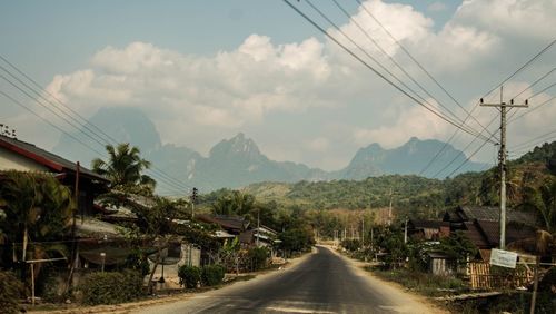 Empty road along countryside landscape