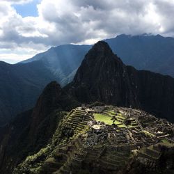 Scenic view of machu picchu against cloudy sky