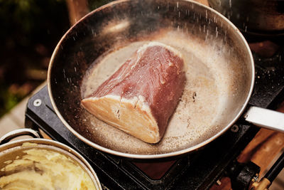 Close-up of meat in cooking pan