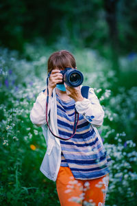 Woman photographing with camera