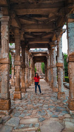 Full length of woman walking in historic building