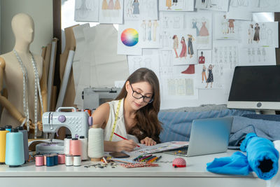 Young woman using laptop at home