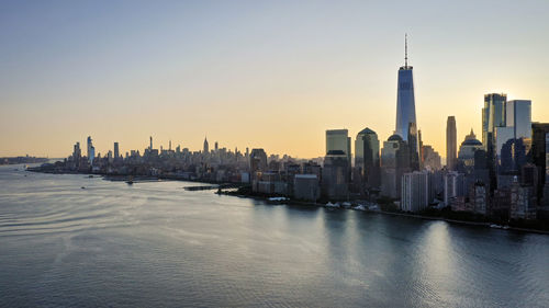 Panoramic view of buildings in city during sunset