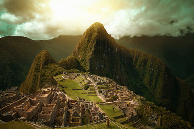 View of old machu picchu archeology site against mountain range