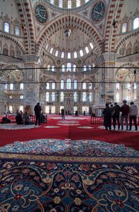 People in corridor of cathedral