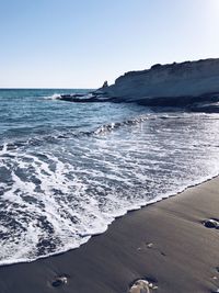 Scenic view of beach against clear sky