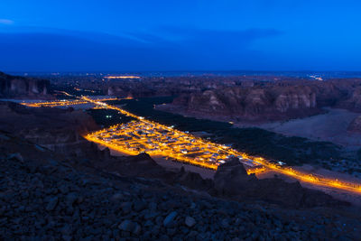 Aerial view of alula town night scape against sky.