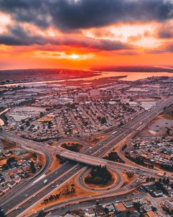 High angle view of city at sunset