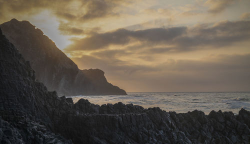 Scenic view of sea in barronal beach of cabo de gata nature park, spain,  against sky during sunrise