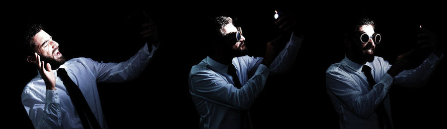 Multiple image of businessman gesturing in darkroom