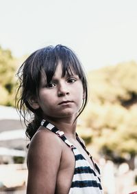 Close-up portrait of boy standing outdoors