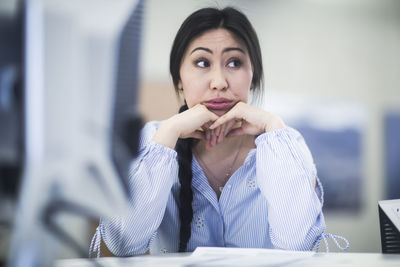 Young asia woman with paper in an office revised