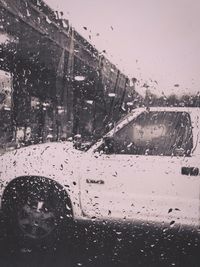 City seen through wet window during rainy season