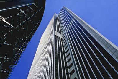 Low angle view of office building against clear sky