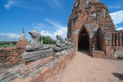 Old temple building against sky