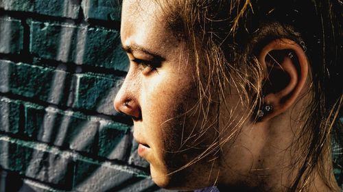 Close-up of young woman looking away