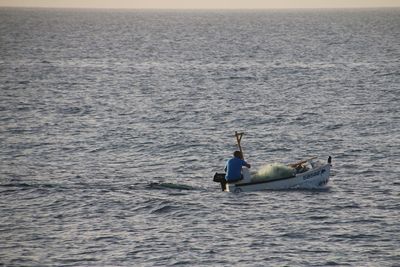 People on boat in sea