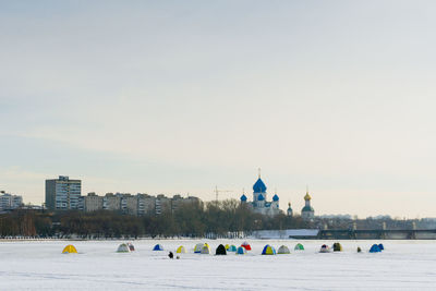 View of buildings in city against sky