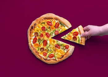 Cropped hand of woman holding food