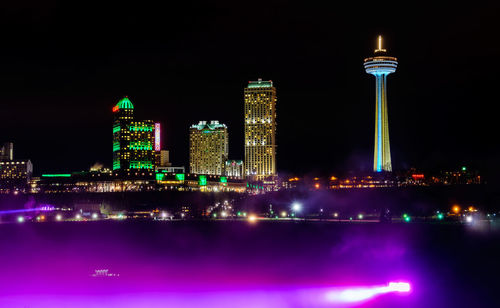 Illuminated city lit up at night